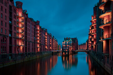 Fototapeta premium View of the Speicherstadt at night.in Hamburg, Germany..Illuminated Speicherstadt as seen from the Poggenmühlenbrücke.