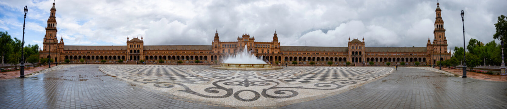 Plaza de Espana in Seville is a perfectly semi circle construct that I captured in this panorama from its equidistant center giving this picture the illusion of a flat building.
