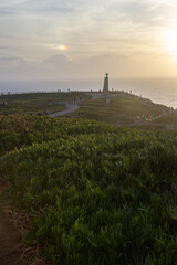 beautiful view on the pic of the hill with people, the most western european point Cabo da Roca