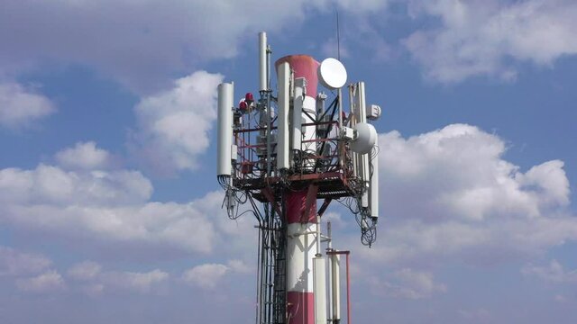 Telecommunication tower of 4G and 5G cellular. Base Station or Base Transceiver Station. Wireless Communication Antenna Transmitter. Telecommunication tower with antennas against blue sky.