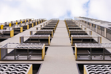 Facades of houses with air-conditioning boxes. New homes immediately provide air conditioning and places for them.