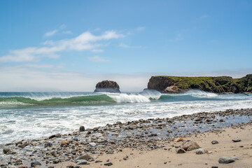Beach and Rock Cliffs By the Sea with Ocean Waves