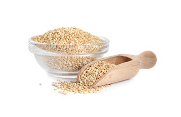 Glass bowl and wooden scoop with quinoa on white background