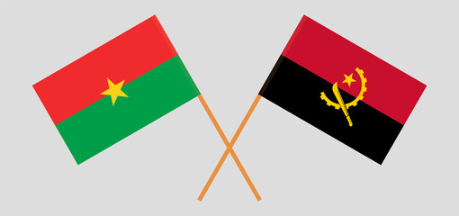 Crossed flags of Burkina Faso and Angola. Official colors. Correct proportion