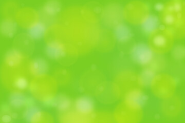 Spring summer abstract green background natural blurred bokeh lights soft focus.