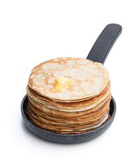 Stack of thin pancakes in small frying pan isolated on white