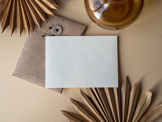 Blank uncoated paper card isolated on beige boho style background	