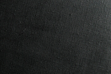 dark creative background: black primed linen canvas, uneven lighting, color toning