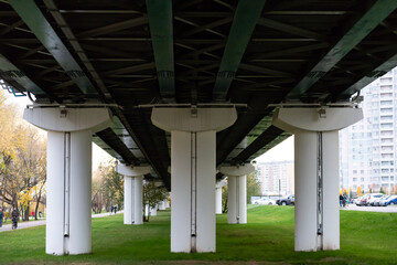 Light Metro Overpass. The metro route follows an overpass through the city park. The photo was taken under the overpass.