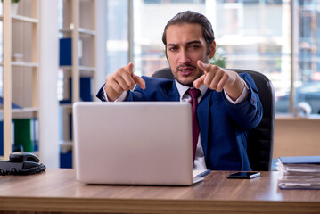 Young businessman employee working in the office