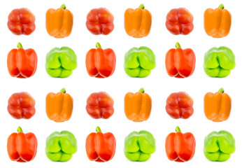 red, green and orange bulgarian pepper pattern vertical row on white background