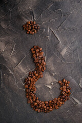 question mark made of coffee beans on black base market concept