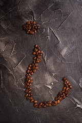 question mark made of coffee beans on black base market concept