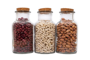 Threer Jars of dried beans, White, Borlotti and Kidney Beans isolated on a white background.. Dried for storage and preservation, long shelf life nutritional food.