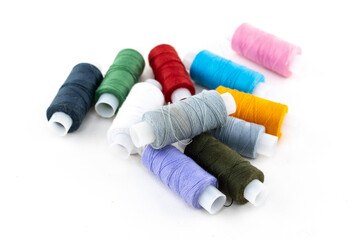 thread material for embroidery and sewing holes on clothes green, lilac and red on a white background