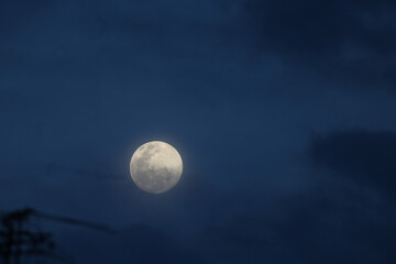 full moon over blue sky
