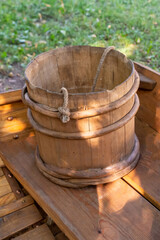 traditional wooden water bucket stands on the table