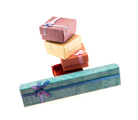 set of long green gifts and a stack of square giftbox red and pink on a white background
