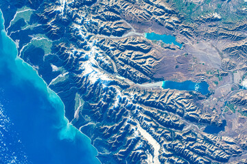 The beauty of New Zealand with snow-capped mountains. Digital Enhancement. Elements of this image furnished by NASA