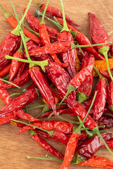 red chili pepper seasoning asia upright on wooden background