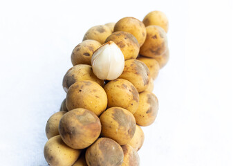 langstan tropical fruit yellow-brown fruit on an isolated background