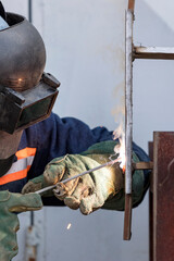 Welder performance qualification test from steel plate and vertical position. The welder is...