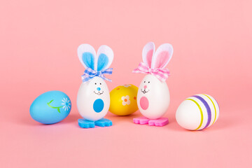 Colorful Easter eggs bunny isolated on pink background