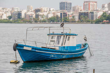 fishing boat over the Rodrigo de Freitas Lagoon in rio de janeiro .