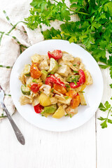 Ragout vegetable with zucchini on white board top