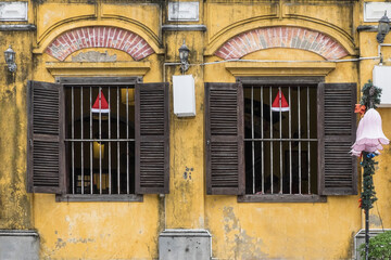 Vietnamese windows with bars and shutters