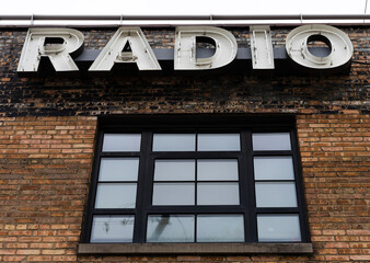 Radio sign on a brick building