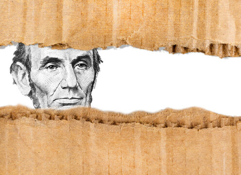 President Abraham Lincoln $5 through ripped cardboard