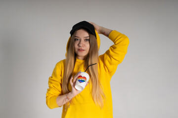 Woman with LGBT rainbow coffee cup