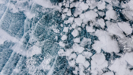 Deep Blue Cracked Ice. Top Aerial View. Frozen Texture of Baikal Lake in Russia