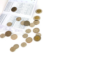 Passbook and coin on the white background.