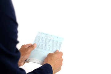Hand holding passbook on the white background.