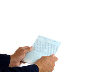 Naklejka premium Hand holding passbook on the white background.