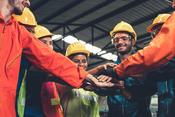 Skillful worker stand together showing teamwork in the factory . Industrial people and...