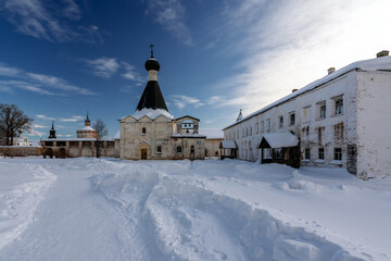 Fototapeta na wymiar View of the Church of Euphemia and the Theological School on the territory of the Kirillo-Belozersky Monastery on a frosty winter sunny day, Kirillov, Vologda region, Russia