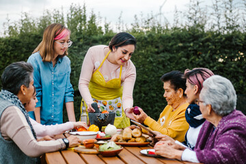 latin mother and daughter cooking together mexican food at home in Mexico city