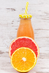 Freshly blended coctail from citrus fruits. Slimming, diet and healthy nutrition concept