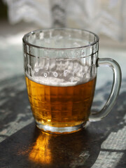 Old Soviet beer mug with beer.