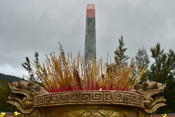Large Incense Burner in Foreground, Vietnamese Obelisk in Background, Hang Duong Cemetery