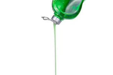 Dishwashing liquid is poured from an open bottle on a white background.