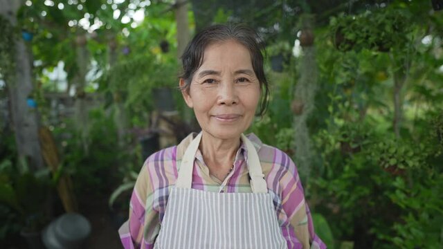 Agriculture concept of 4k Resolution. Asian older women are confident in gardening.