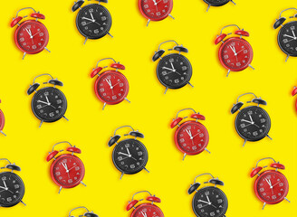 Many alarm clocks on color background