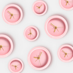 Many alarm clocks on white background