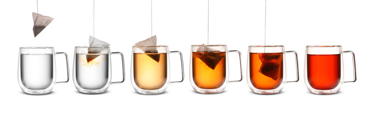 Process of making tea in glass cup on white background