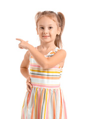 Cute little girl pointing at something on white background