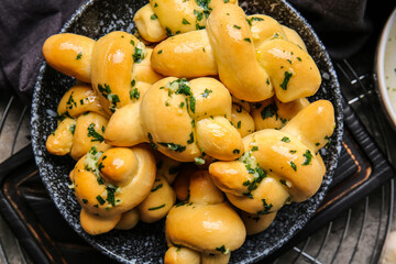 Plate with tasty garlic buns, closeup